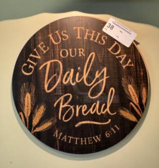 Round wooden picture with "Give Us This Day Our Daily Bread" text and wheat design, featuring Matthew 6:11 verse.