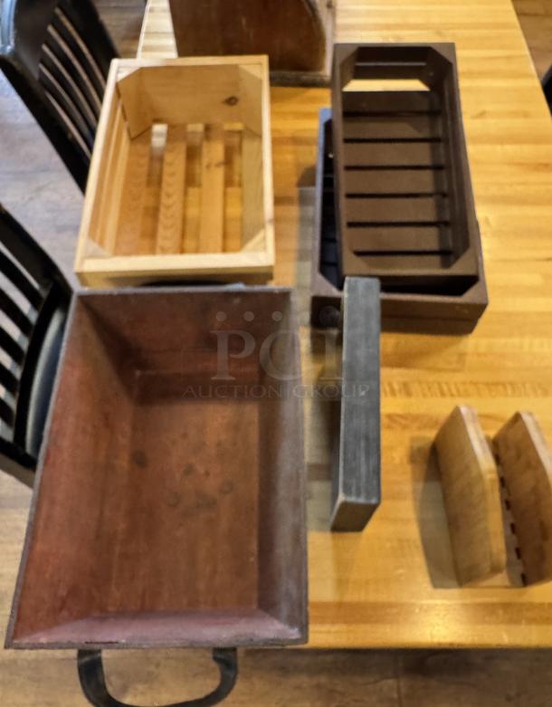 Assorted display wooden boxes and baskets in various shapes and finishes, used condition, suitable for storage or decor.