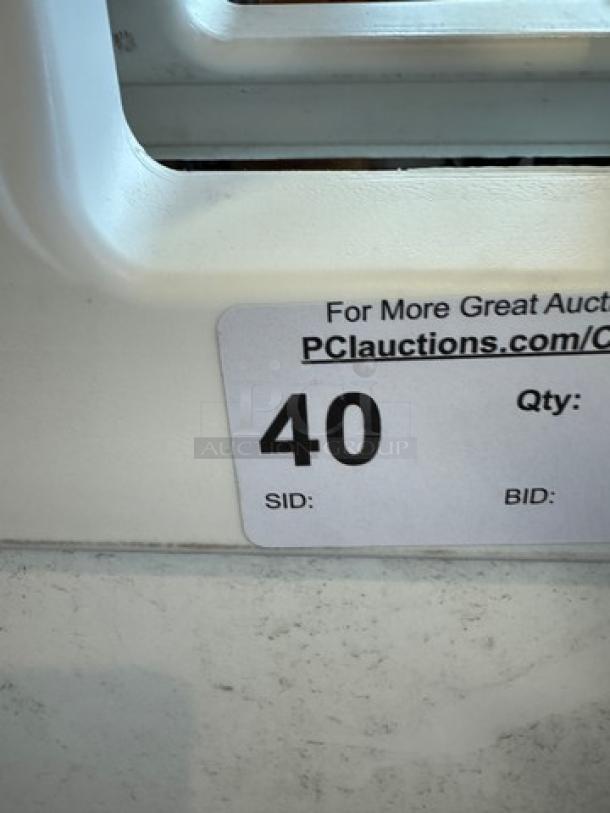 Signature Deluxe Portable Advertising Sign with visible tag showing auction details, suitable for indoor and outdoor use.