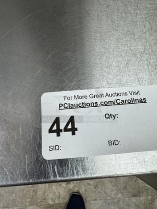 Stainless steel equipment stand with galvanized shelf, auction tag 44 visible, indicating auction site and details.