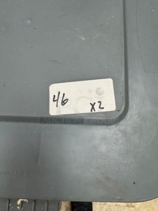 Rubbermaid 28 Gal. dry goods container on casters, gray, tag marked "4/6 x2," durable plastic, stackable, used condition.