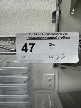 Stainless wire shelving with visible auction label showing lot number 47 and quantity of two.