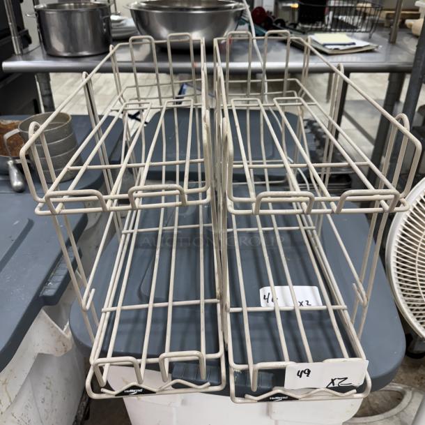 Intermetro metal racks, set of 2, used condition. Labels indicate "49 x2" and "42 x2." Ideal for storage or organization.