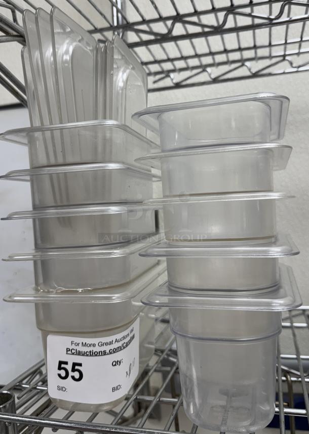 Stack of 10 acrylic pans with lids, size 1/6 x 4, labeled "55" for auction. Clear with visible tags, good condition.