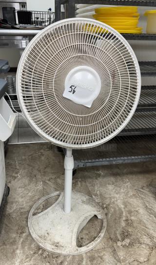 Lasko floor fan, white, tested and working, with adjustable height. Features a labeled number "56". Good condition.