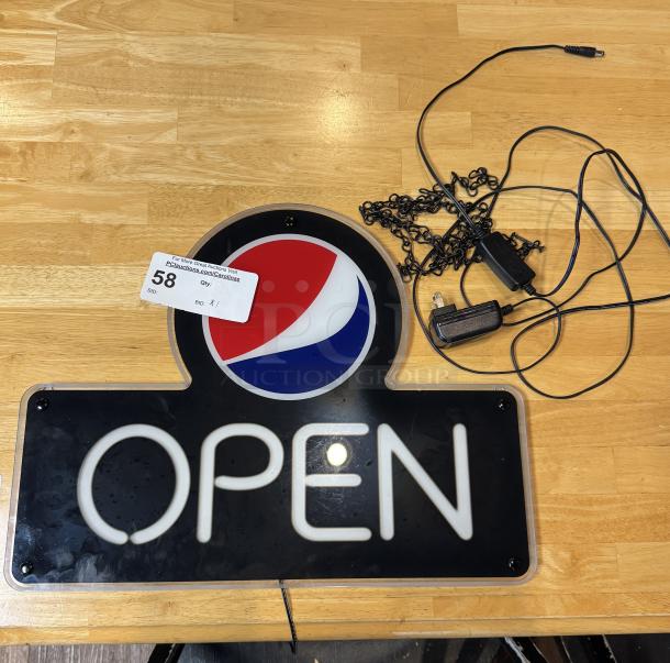 "Open" Pepsi sign with logo, tested and working, includes power cord and mounting chain, auction tag visible.
