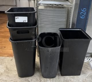 Set of five black plastic trash cans, rectangular, moderate wear, labeled "60 x5." Suitable for commercial use.