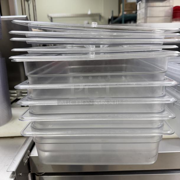 Cambro full-size containers with lids, stacked, clear plastic, excellent condition, set of four, ideal for storage or catering.