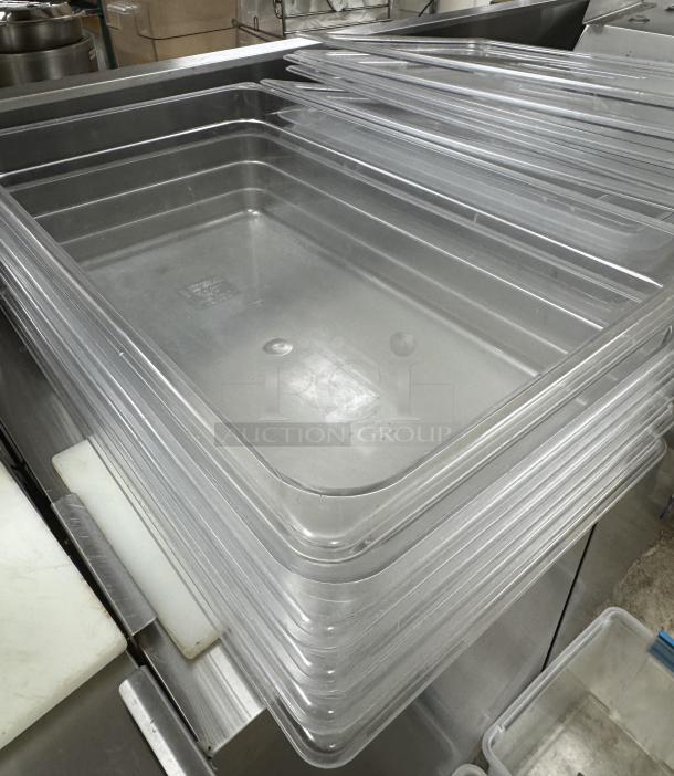 Cambro full-size containers with lids, stacked, clear plastic, excellent condition, ideal for kitchen storage.