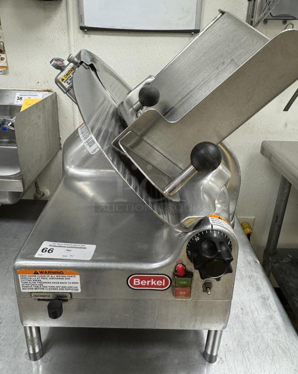 Berkel Slicer Model 919/1, 115V 1 Phase, tested and working, stainless steel, excellent condition. Features safety warnings.