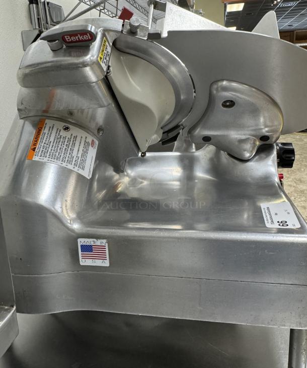 Berkel Slicer Model 919/1, 115 V, 1 Phase, tested and working. Features visible safety and warning labels, "Made in USA."