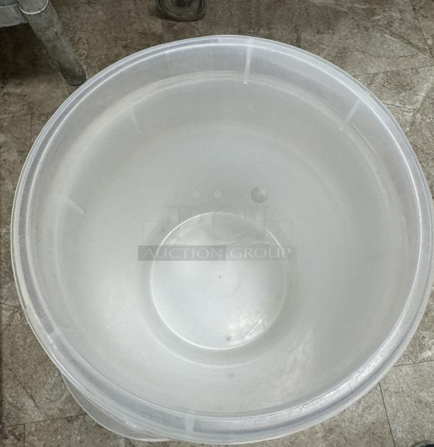 Rubbermaid plastic container, translucent, large size, circular shape, no lid visible, some scuff marks, used condition.