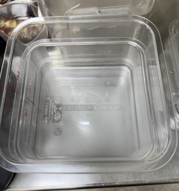 Cambro square plastic container, clear with lid. Features volume markings. Set of 4 in good condition.