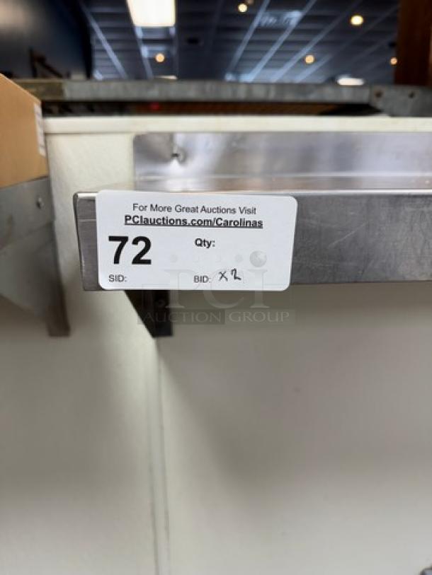 Two stainless steel shelves, sizes 48x10x12 and 24x10x12. Tag indicates lot 72 for auction.
