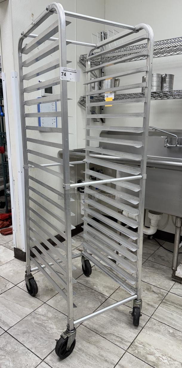 Metal sheet pan rack with 18 slots, four swivel casters, and a label indicating "74". Ideal for commercial kitchens.