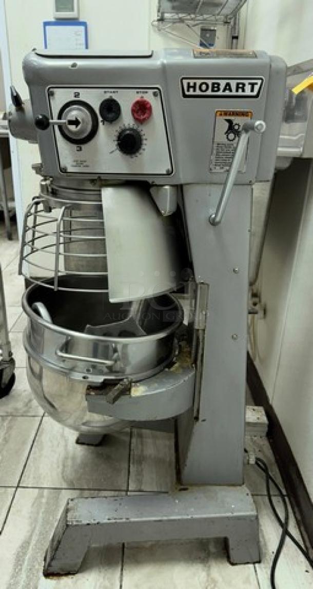 Hobart 30 Qt. Mixer with bowl and attachments. Tested, working condition, featuring control dials and safety guard.