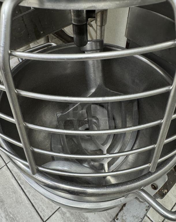 Hobart 30 Qt. Mixer with bowl and attachments shown in working condition, featuring a durable metallic design.