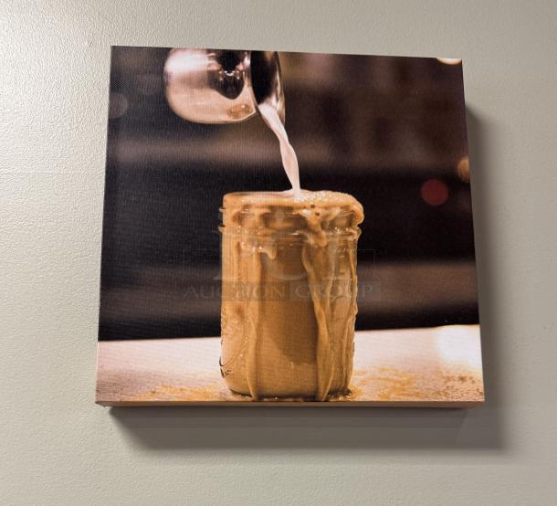 Decorative wall picture featuring a coffee drink being poured into a glass jar. Canvas print in excellent condition.