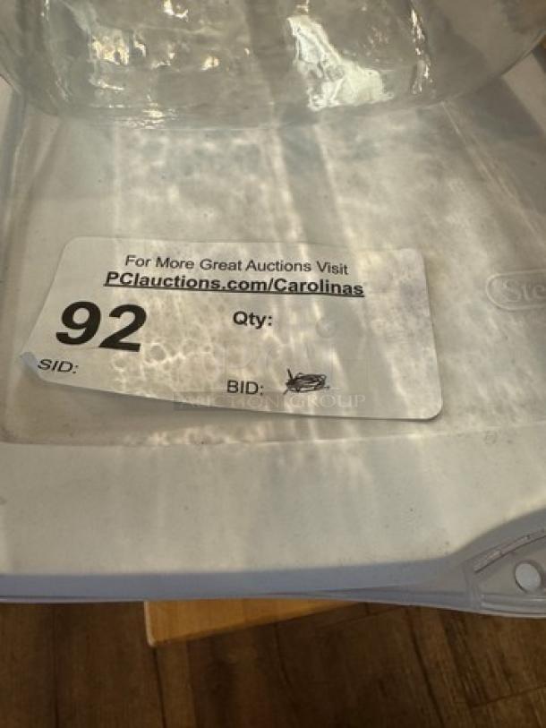 Assorted storage containers with lid, featuring auction label number 92. Clear and white plastic, good condition.