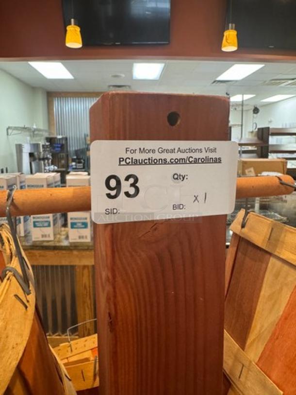 Wooden basket floor display with multiple tiers. Label indicates auction lot number 93. Sturdy condition, ideal for retail use.