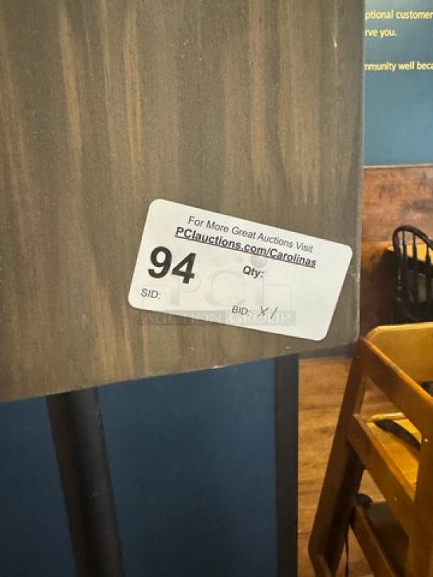 Decorative wooden menu floor sign with a dark wood finish, showing auction label "94". Sturdy condition, ideal for restaurants.