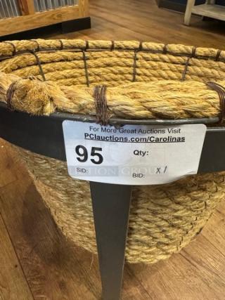 Metal and rope floor display with woven rope basket and sturdy metal frame. Auction tag indicates item number 95.