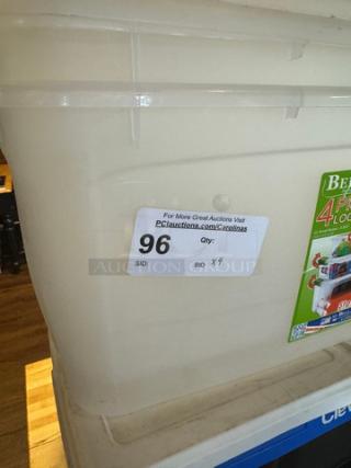 Assorted plastic totes, stackable, beige, auction label noting lot 96, visible wear. Includes 4 for bidding.