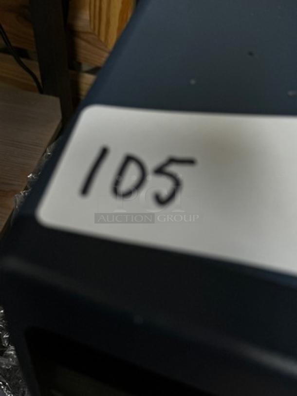 Westmark Labeling System, black casing, includes 5 rolls of labels. Visible tag marked with "105." Used condition.