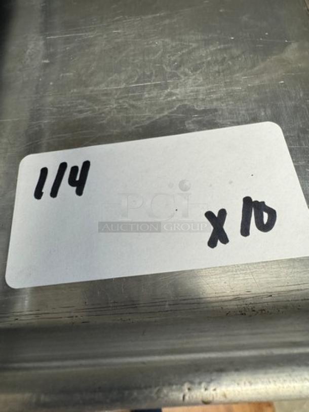 Full-size sheet pans, set of 10, stainless steel, lightly used. Label shows "1/4 x 10" indicating quantity.