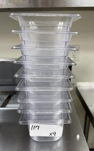 Stack of nine Vollrath acrylic pans, 1/6 size. Clear, pristine condition, with visible label "x9 117."