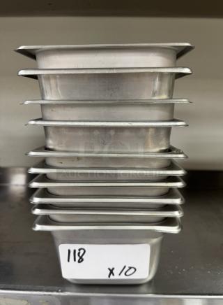 Stack of 10 stainless steel 1/6 x 4 pans, lightly used, labeled "118 x10," ideal for commercial kitchens.