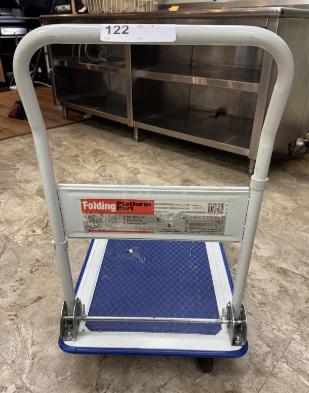 Rolling folding platform cart with blue non-slip surface, metal frame, condition shows signs of use. Marked "Folding Platform Cart."