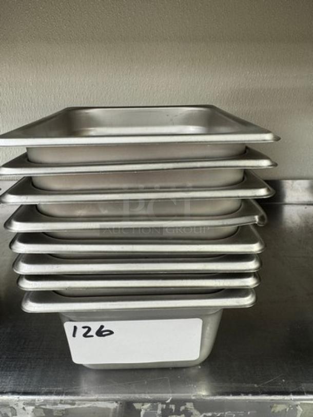 Stack of eight stainless steel 1/6 x 4 pans in good condition, tagged with number 126, ideal for commercial kitchen use.