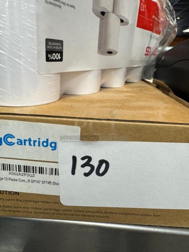 Star Sp700 Receipt Printer with 4 ribbon cartridges and 7 paper rolls. Model SP742; includes packaging and accessories.