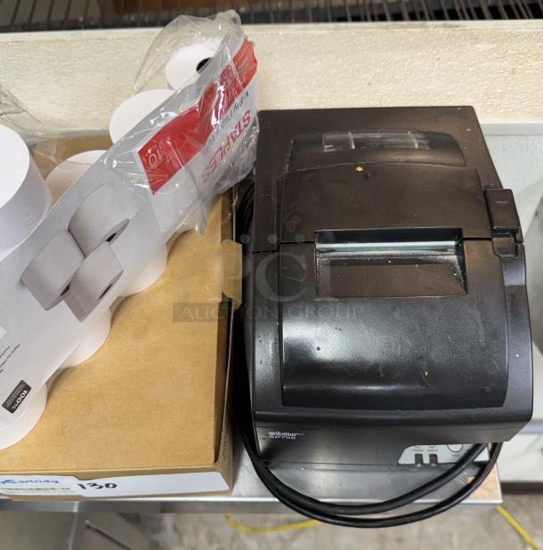 Star Sp700 receipt printer, fair condition, with 4 ribbon cartridges and 7 rolls of paper, visible brand labeling.
