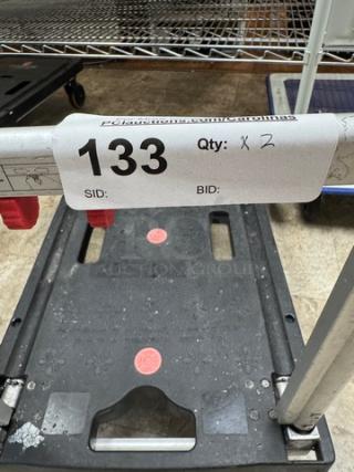 Rolling folding platform truck, black, with red locking mechanism. Good condition, auction lot number 133, quantity 2.