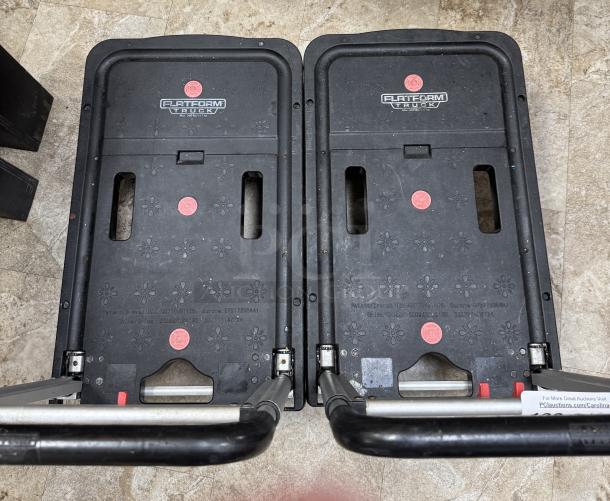 Two black rolling folding platform trucks with floral pattern, metal handles, and visible "Flat Form Truck" logo.