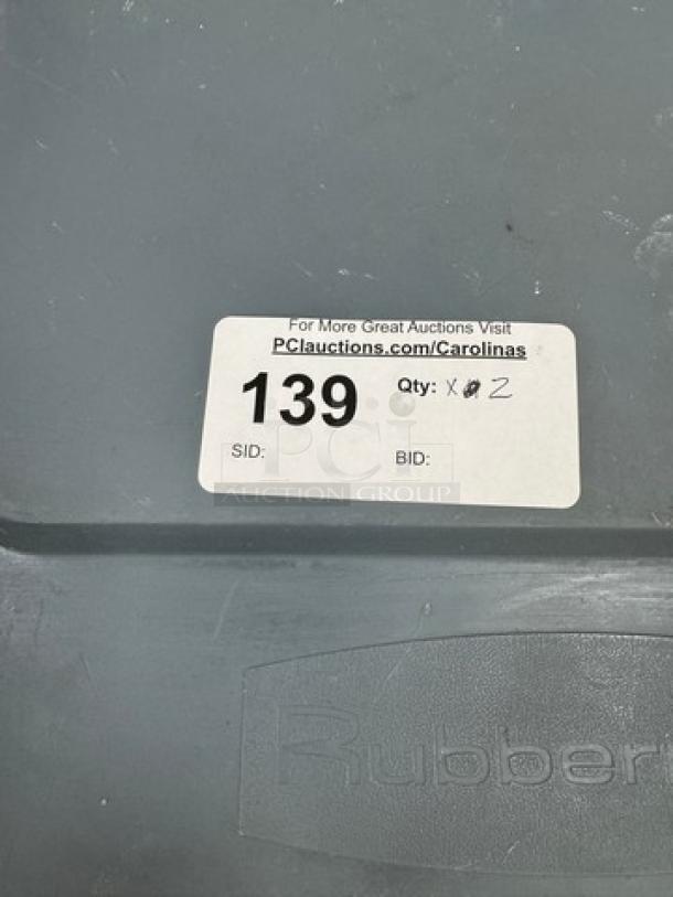 Rubbermaid rolling dry goods storage container, grey, with auction label showing "139" and quantity "2," good condition.