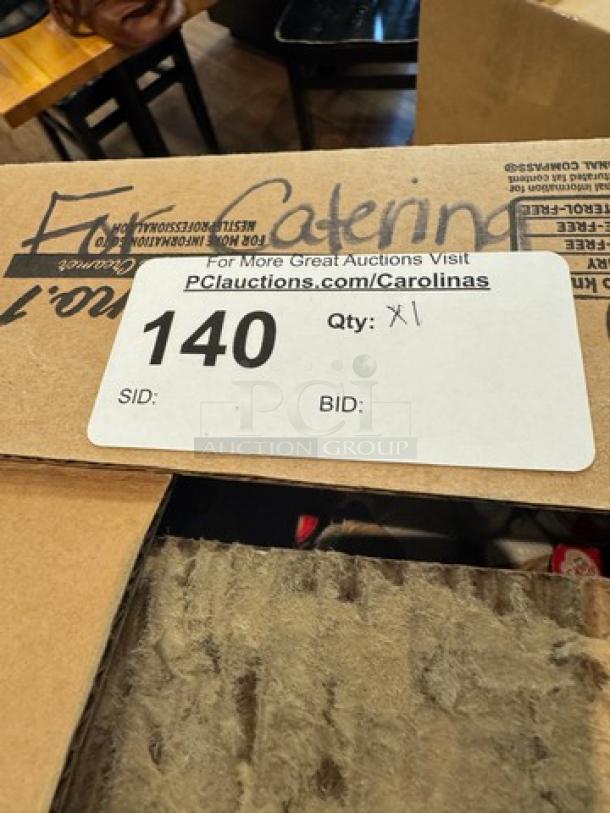 Box of assorted coffee condiments, including Coffee Mate, sugar, and Splenda. Auction label reads "140" and "Qty: X1".