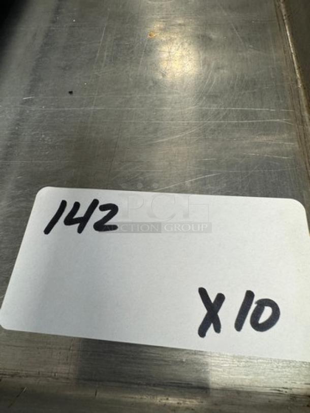 Full size sheet pans, set of 10, used condition. Marking reads "142 X 10" indicating quantity for auction.