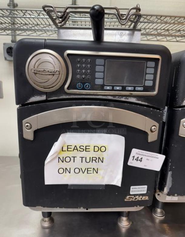 Turbo Chef Sota Oven for parts, scratched exterior, control panel intact, "DO NOT TURN ON" sign, auction tag visible.