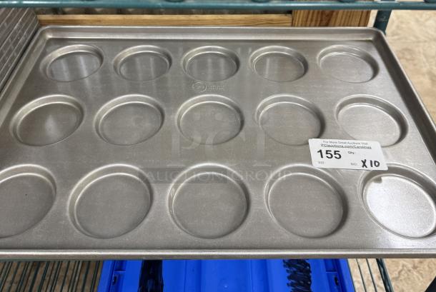 Chicago Metallic cookie sheet with 12 circular molds, part of a 10-piece bid. Appears in excellent condition.