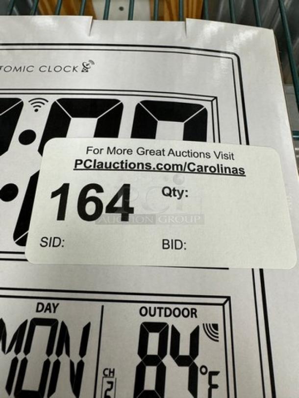 New Sharp Atomic Wall Clock in original box, featuring digital display. Auction label states lot number 164.