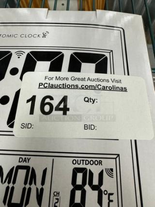 New Sharp Atomic Wall Clock in original box, featuring digital display. Auction label states lot number 164.