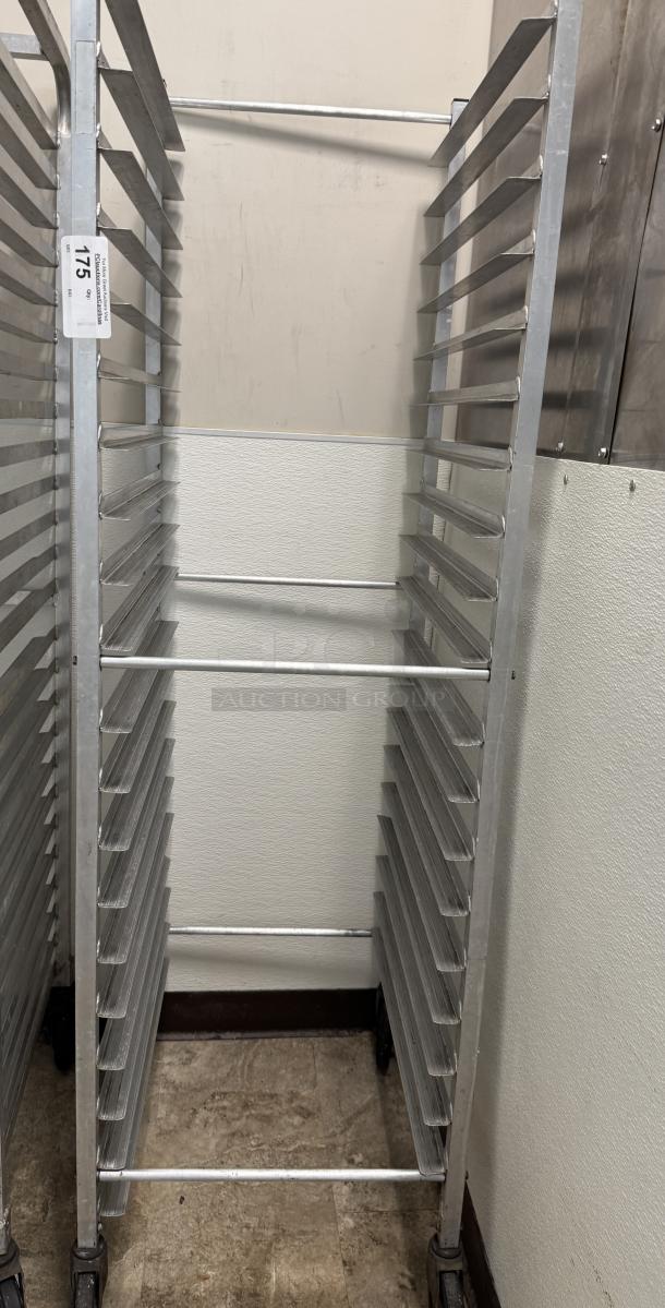 Rolling sheet pan rack, metal, with multiple slots, good condition, on wheels, tag shows "175" for auction reference.
