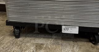 Full size sheet pan rolling rack with multiple tiers, featuring durable caster wheels. Auction ID 177 visible on label.
