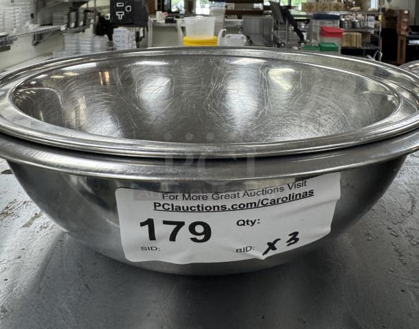 Stainless mixing bowls, set of three, visible surface wear, auction label with lot number 179, bidding quantity x3.