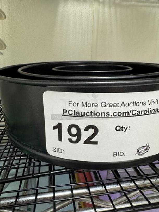 Expandable cake pans with cooling racks, sizes 4", 7", 8.5". Item number 192 label visible.
