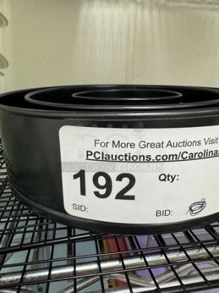 Expandable cake pans with cooling racks, sizes 4", 7", 8.5". Item number 192 label visible.