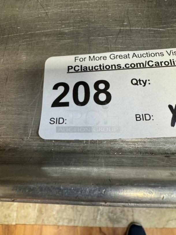 Half size sheet pan with auction label reading "208." Used, durable, steel construction. Set of 10 available for bidding.